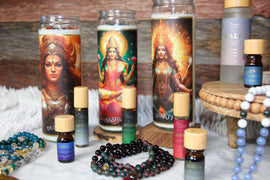 Shakti SOULutions altar candles, crystal malas, organic essential oils, anointing oils and aura sprays arranged together as intentional sacred living products.