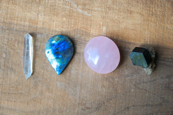 four crystals to beat stress quartz, labradorite, rose quartz, black tourmaline